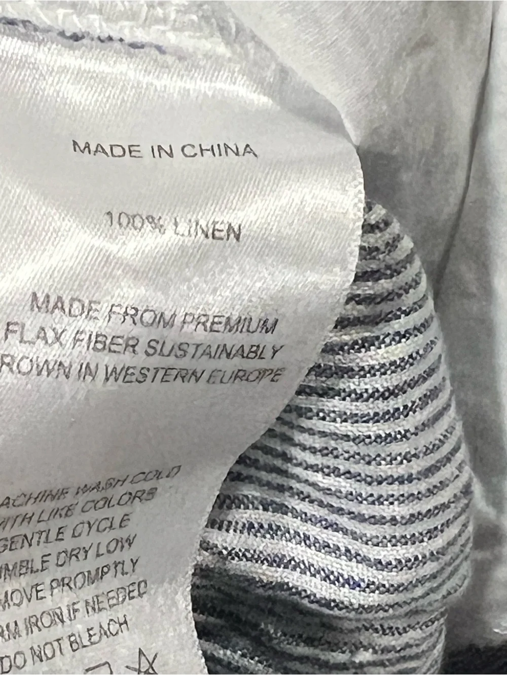 Quince 100% European Linen Tapered Ankle Pants in the Blue Pinstripe pattern.